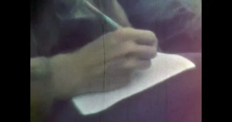 Man's hands write with pen on piece of paper. Handwritten text with pencils Stock Footage 255667896