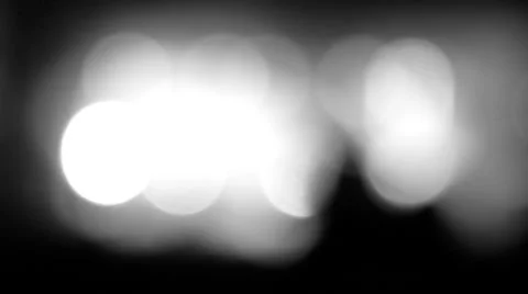 Man's head with a beard against lights in bokeh. Stylish black and white. Stock Footage 67777067