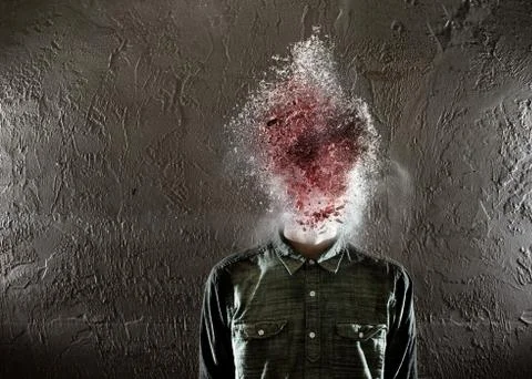 A man's head exploding. there is red in the middle and then some white on the Stock Photos