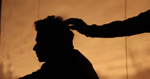 Man’s Head Silhouette in Yellow Light Stock Footage 335433549