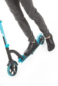 Man's legs on a push-cycle Stock Photos