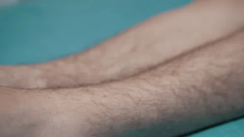 Mans legs on turquoise surface Stock Footage 312011253