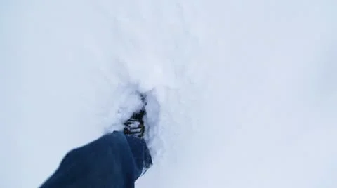 Man's Legs Walking Through the Snow Stock Footage 10701293