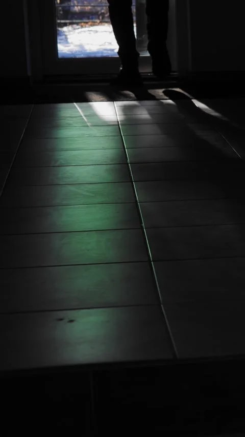 Man's legs walking towards the exit of the room along narrow corridor Stock Footage 324791405