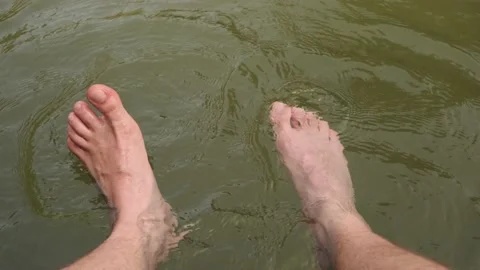 A man's legs in the water Stock Footage 160340783