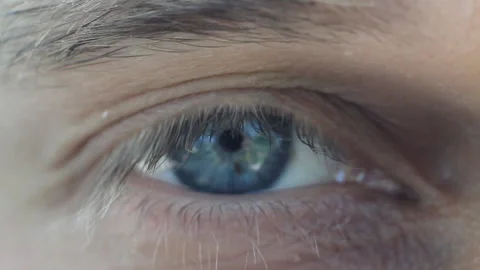 Man's macro eye with blue iris are blink Stock Footage 90266509