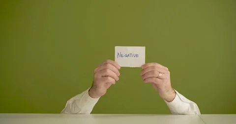 The man's mini picks up a sheet where it is written Negative Stock Footage 267090861