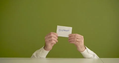 The man's mini picks up a sheet where it is written District Stock Footage 267091428