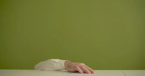 The man's mini picks up a sheet where it is written Make Your Day Stock Footage 267091471