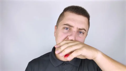 The man's nose started bleeding. High blood pressure caused blood vessels to rup Stock Footage 139202349