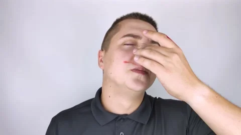 The man's nose started bleeding. High blood pressure caused blood vessels to rup Stock Footage 139202358