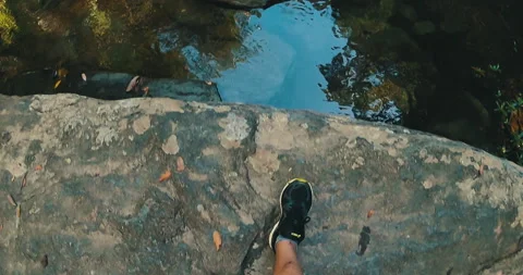 Man's point of view on top of a waterfall Stock Footage 162524318