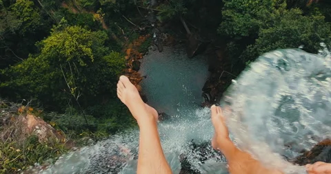 Man's point of view on top of a waterfall Stock Footage 162524399