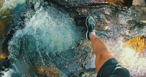 Man's point of view on top of a waterfall Stock Footage 162524471