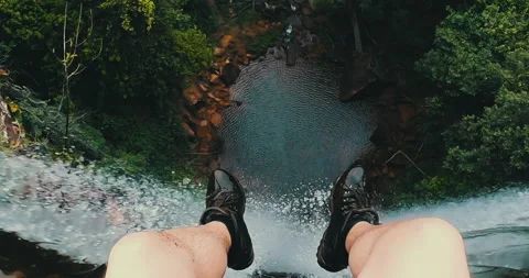 Man's point of view on top of a waterfall Stock Footage 162524501