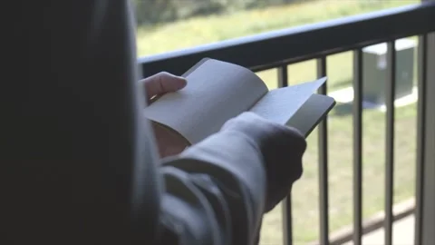 A man's reading is wedding vows over a porch Video stock 147399765