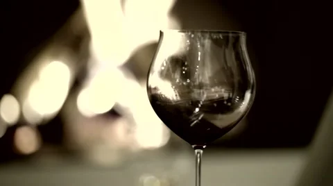 Mans reflection in vine glass horror scene near fireplace Stock Footage 62735440