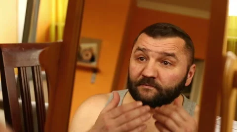Man's relflection in the mirror , man checking his face  Stock Footage 61303329