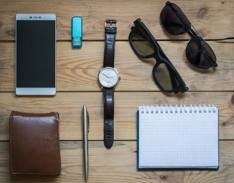 Man's set background: wallet, smartphone, pen, watch, notepad and Sunglasses Stock Photos