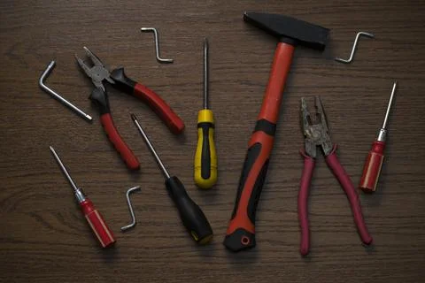 Man's set of instruments for house work on the wooden table Stock Photos
