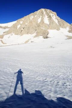Man's shadow and mountain Stock Photos