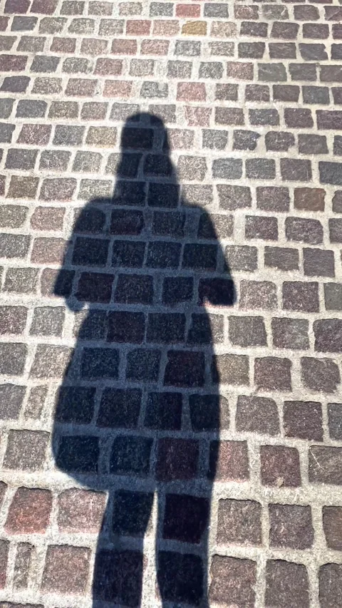 A man's shadow from the sun. Vertical video Stock Footage 286346019