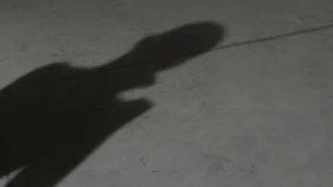 Man's shadow training and boxing. Shadow of the boxer man boxing on the wall Stock Footage 77479769