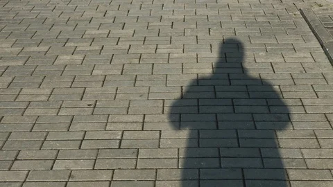 The man's shadow is walking on the outside. Stock Footage 109283018