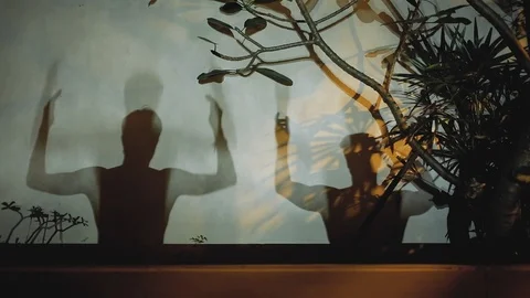 Mans shadows art dance game on the wall Stock Footage 106337108