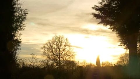 Mans silhouette walking on a sunset view across a field  Stock Footage 85644821