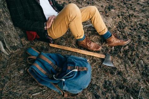 Man's things on a hiking trip: backpack and ax Stock Photos