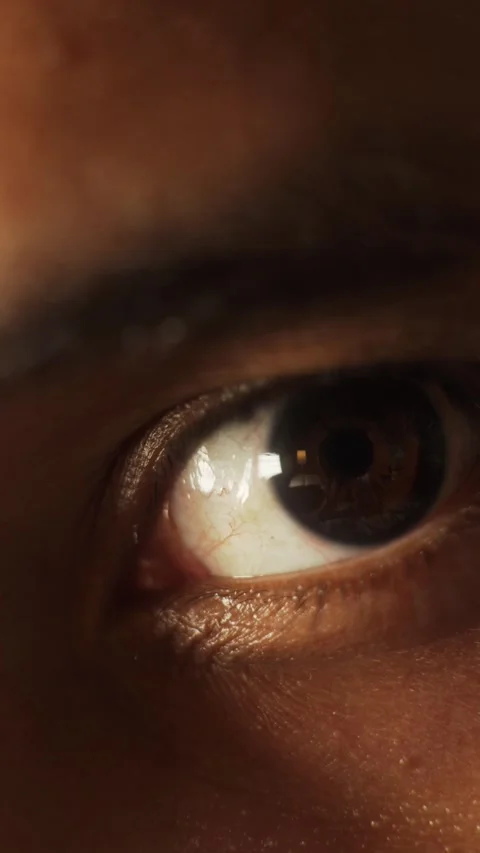 Man's tired eye reflecting light during sleepless night of work Stock Footage 327307704