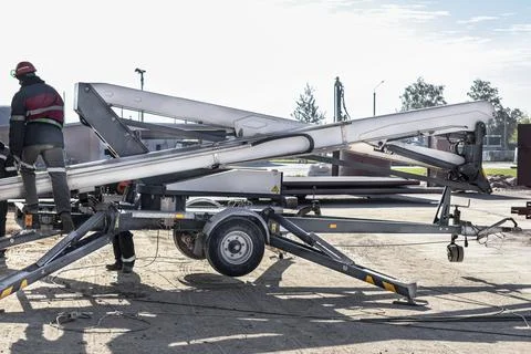 Man's work is at a height. Self-propelled construction mechanism 스톡 사진