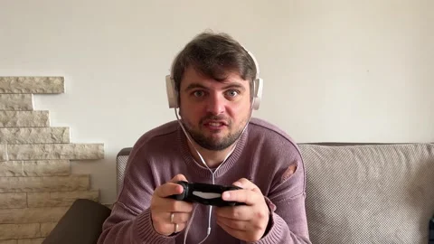 Mansi sitting on the couch, emotionally playing the console, losing the game Vidéo 237910201