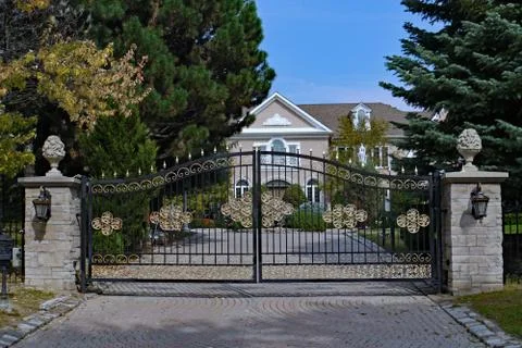 Mansion with gilded gate Stock Photos