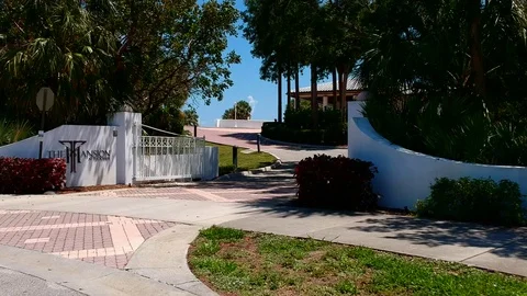 Mansion by water and trees Stock Footage 89949114