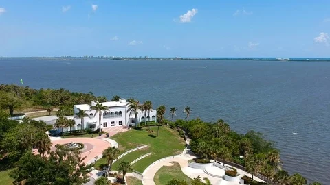 Mansion by water and trees3 Stock Footage 89949150