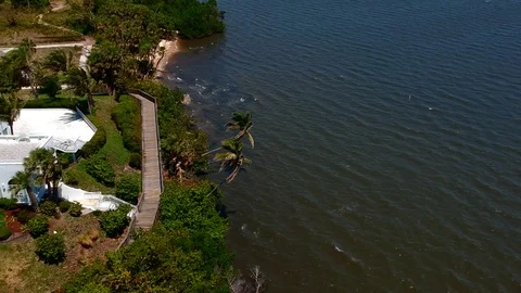 Mansion by water and trees5 Stock Footage 89949340