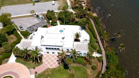 Mansion by water and trees8 Stock Footage 89949255