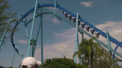 Manta Flying Rollercoaster Going Up Chainlift and Down First Drop Stock Footage 21960546