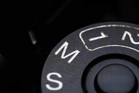 The manual adjustment dial is close on the camera. Old and dirty Stock Photos