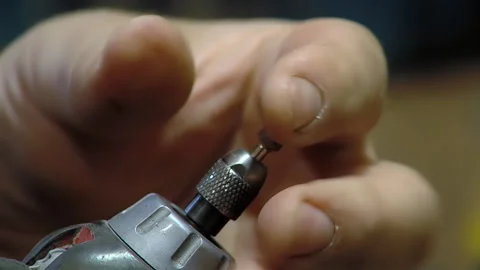 Manual Adjustment of Drill Bit by Hand on Power Drill, Technical Process - 4K Stock Footage 276554368