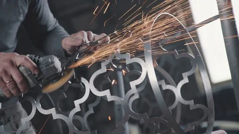 Manual angle grinder for cutting metal. Sparks when cutting Stock Footage 74695457