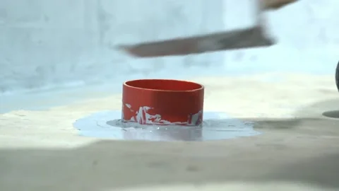 Manual application of waterproofing on the floor on the construction site Stock Footage 231518597