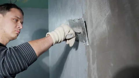 Manual application of waterproofing to the wall on the construction site Stock Footage 231518045