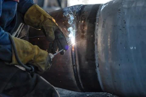 Manual arc welding of large diameter pipeline elements Stock Photos