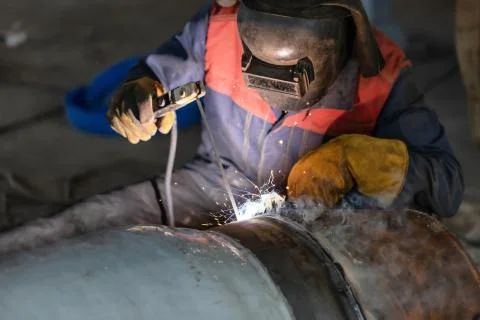 Manual arc welding of large diameter pipeline elements Stock Photos