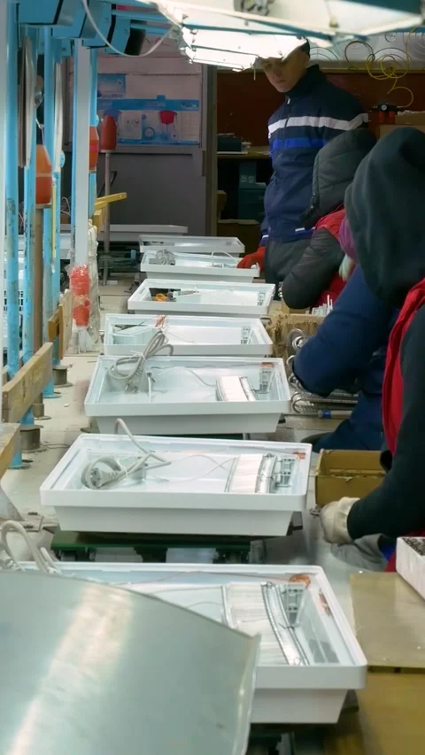 Manual assembly conveyor. Vertical video. Stock Footage 269664223