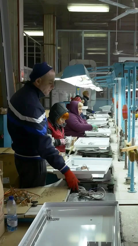 Manual assembly conveyor. Vertical video. Stock Footage 269664224