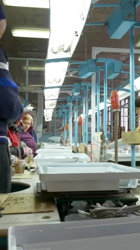 Manual assembly conveyor. Vertical video. Stock Footage 269664262